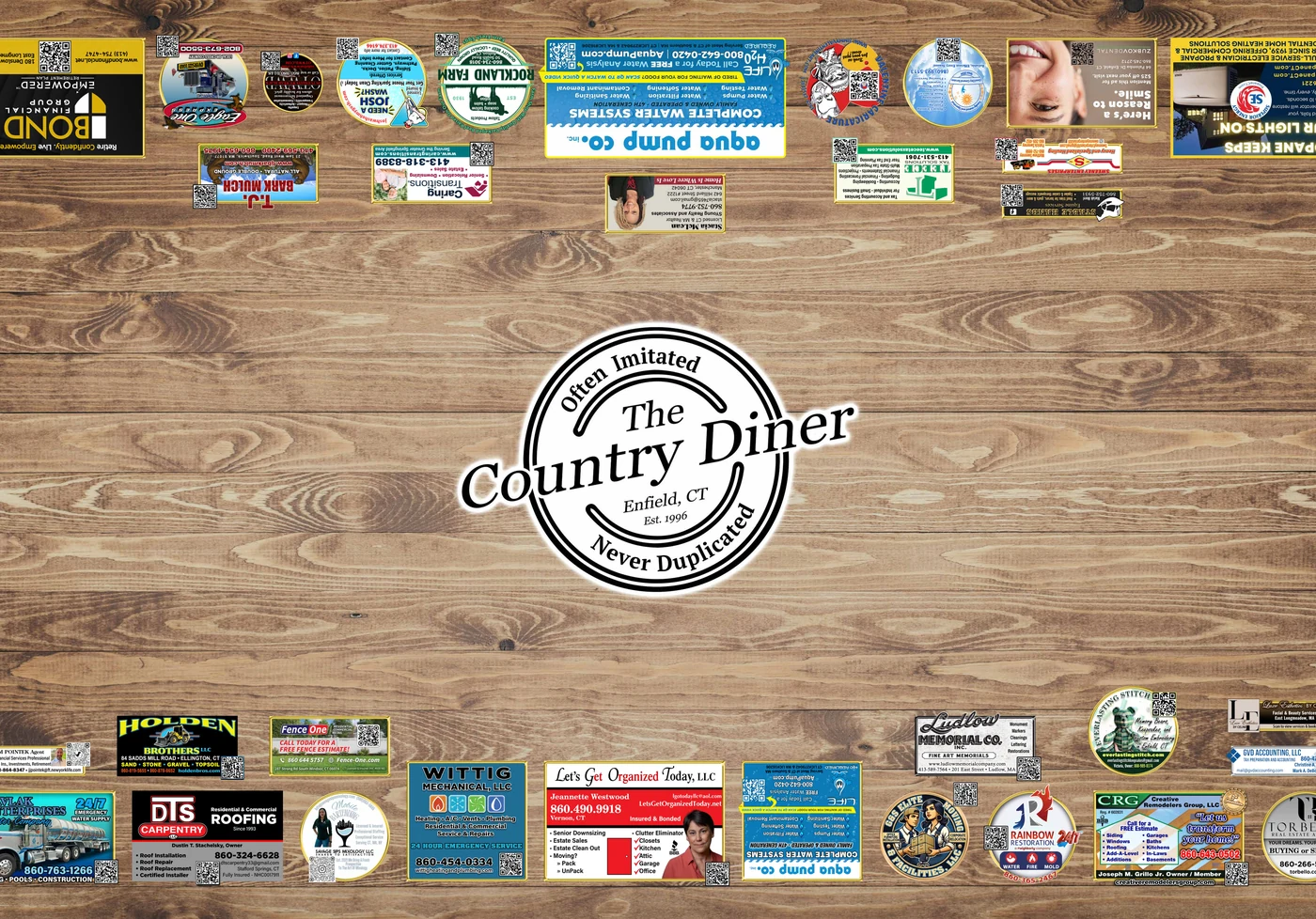 The Country Diner tabletop — rustic wood with circular logo